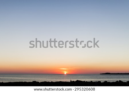 sunset on the rocks. minimalist scene