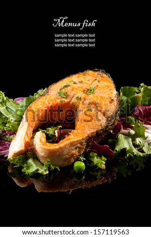 Roasted salmon with vegetables  (black background)