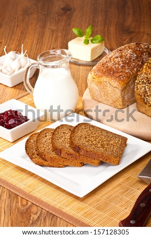 Breakfast with wholemeal bread and jam and milk