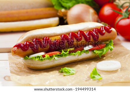 Hot dogs with mustard, ketchup on a picnic table