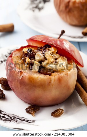 Baked apples with nuts and raisins - focus on apple