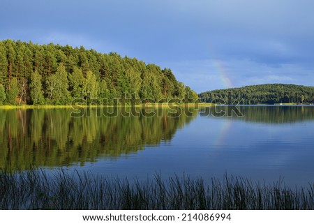 Kashubian lake in the afternoon sun after rain