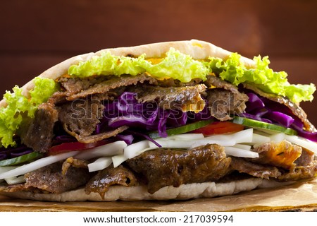 Beef Kebab in a bun on woodboard