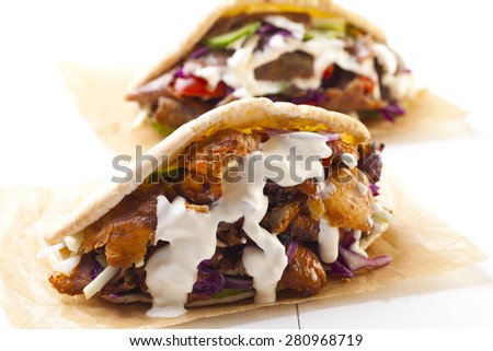 Beef and Kebab in a bun with garlic sauce