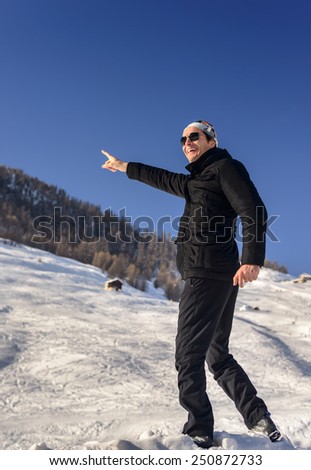 Man looking at the sky and pointing at the sky