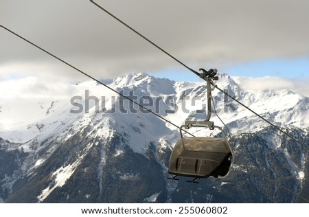 mountains with modern ski lift chair