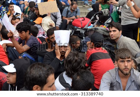 BUDAPEST - SEPTEMBER 5 : War refugees at the Keleti Railway Station on 5 September 2015 in Budapest, Hungary. Refugees are arriving constantly to Hungary on the way to Germany.