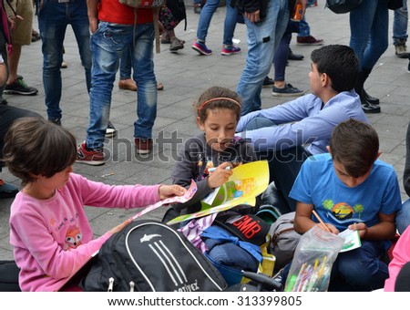 BUDAPEST - SEPTEMBER 5, 2015 : War refugees at the Keleti Railway Station on 5 September 2015 in Budapest, Hungary. Refugees are arriving constantly to Hungary on the way to Germany.