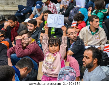 BUDAPEST, HUNGARY - SEPTEMBER 5, 2015 : Refugees at the Keleti Railway Station on 5 September 2015 in Budapest, Hungary. Refugees are arriving constantly to Hungary on the way to Germany.