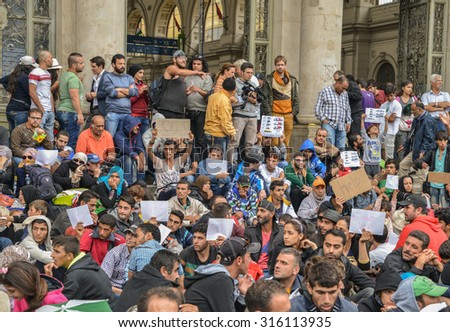 BUDAPEST, HUNGARY - SEPTEMBER 5, 2015 : Refugees at the Keleti Railway Station on 5 September 2015 in Budapest, Hungary. Refugees are arriving constantly to Hungary on the way to Germany