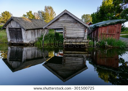 29.07.2015 - Grisslehamn, Sweden - Old boat houses sit along the harbor in Grisslehamn, Sweden