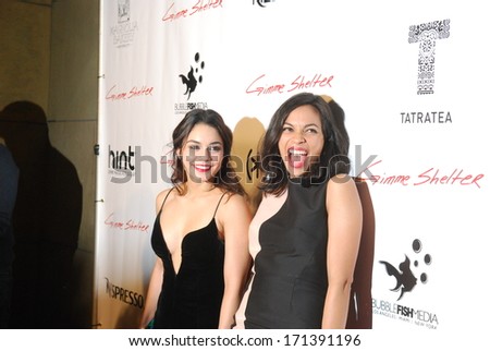 HOLLYWOOD - JANUARY 14:  Actresses Vanessa Hudgens and Rosario Dawson pose for pictures after the screening of Gimme Shelter at The Egyptian Theater on January 14, 2014 in Hollywood.
