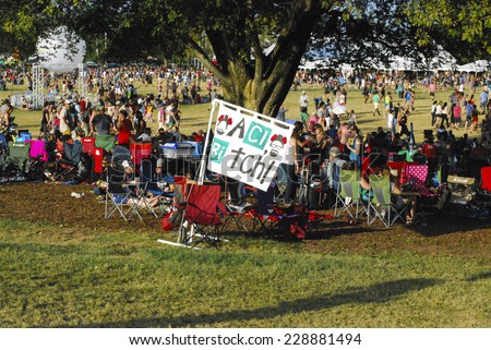 Austin - October 12: Festival goers seek shade during the  Austin City Limits Music Festival on October 12, 2014.