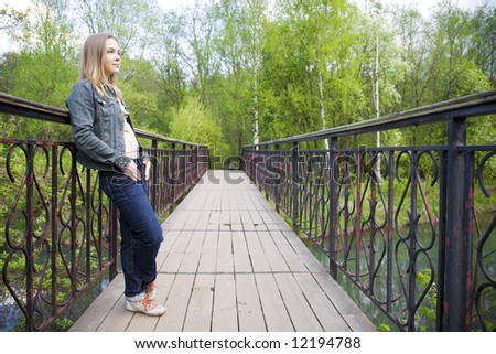 Young Woman Looking Forward From The Bridge