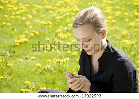 Message. Young Woman With Cell Phone.