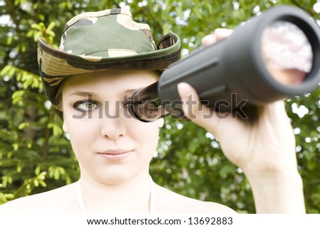 Young Woman Looking Through Binoculars