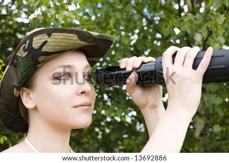 Young woman searching with binocular