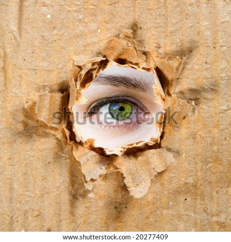 Hole in Paper And Eye. Paper and Cardboard Series.