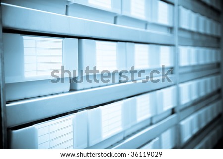 Wall of Gray Plastic Filing Cabinets Drawers