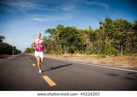 Beautiful woman running cross country. Sport collection.