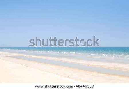 Beach background with clean sand  and blue sky