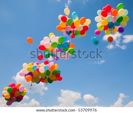 Lots of colorful balloons on the sky background