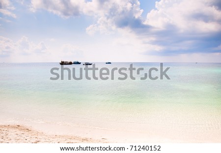 Summer beach background with clean sand and blue sky