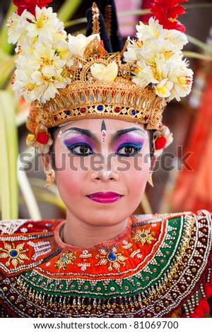 BATUBULAN, BALI, INDONESIA- JUNE 23: Unidentified woman posing for tourists at the weekly  Barong Dance, the traditional balinese performance on June 23, 2011 in Batubulan, Bali, Indonesia.