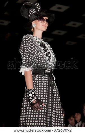 MOSCOW - OCTOBER 21: A model displays a creation by Russian designer Slava Zaitsev during Mercedes-Benz Fashion Week Russia on October 21, 2011 in Moscow, Russia.