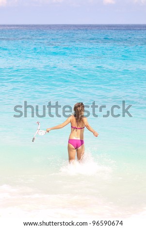 Snorkel Woman Running at the Tropical Beach