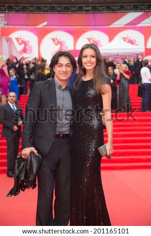 MOSCOW - JUNE, 19: Russian actor Evklid Kurdzidis with friend. 36th Moscow International Film Festival. Opening Ceremony at Pushkinsky Cinema . June 19, 2014 in Moscow, Russia