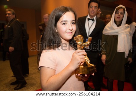 BERLIN, GERMANY - FEBRUARY 14: H. Saedi, golden bear on behalf of her uncle Jafar Panahi. Closing Ceremony. 65th Berlinale Film Festival at Berlinale Palace on February 14, 2015 in Berlin, Germany.