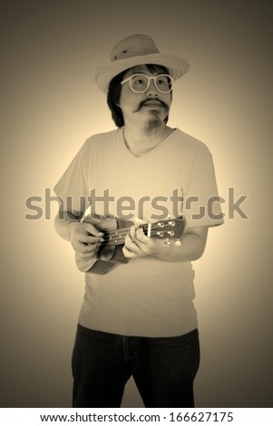 Vintage design man with ukulele isolated