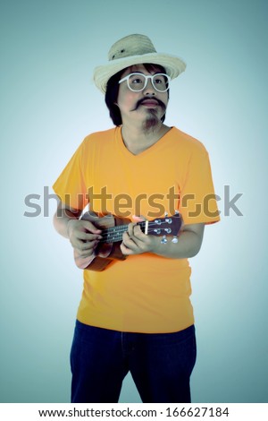 Vintage design man with ukulele isolated