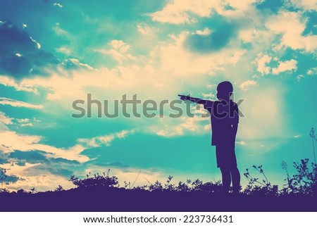 kid silhouette,Moments of the child's joy. looking for future, On the Nature sunset
