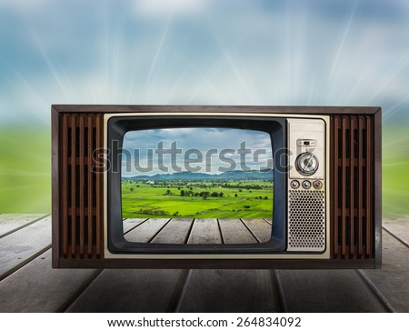 Old vintage TV in the Vintage wooden with nature view