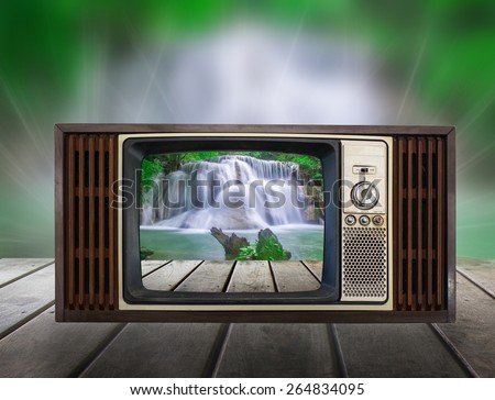 Old vintage TV in the Vintage wooden with water fall view