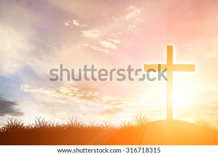 cross silhouette on the mountain at sunset