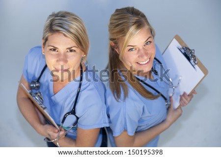 Overview of two happy health care professionals smiling