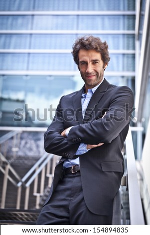 Proud Businessman In Front Of His Office