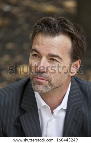 Businessman lost in thoughts