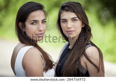 Two young women smiling at the camera