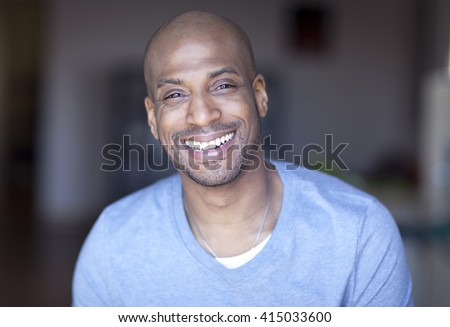 Portrait Of A Mature Black Man Smiling At Home