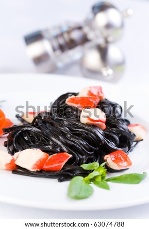 Black tagliatelle pasta with crab cubes