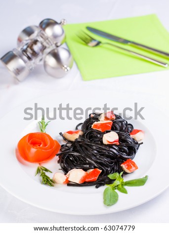 Black tagliatelle pasta with crab cubes