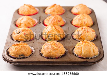 Freshly made muffins in a baking tray