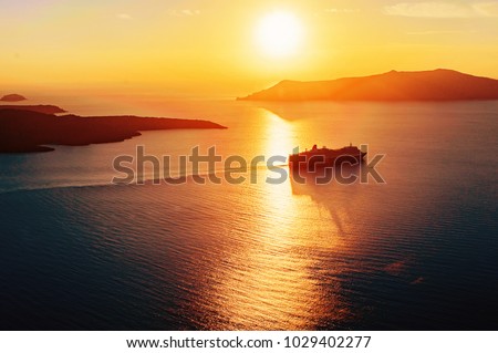 Cruise ship silhouette in sunset light