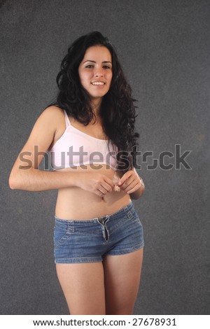 stock photo Beautiful cuban girl smiling and holding a measuring strip
