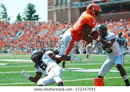 CHAMPAIGN,IL-AUGUST 31: Illini tight end Jon Davis (3) dives into the end zone scoring a touchdown during the second quarter of the game against SIU on Saturday, Aug 31, 2013.