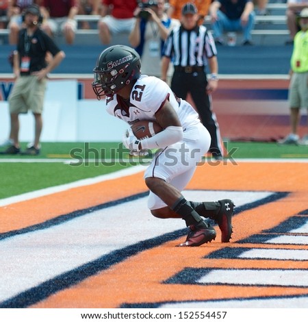 CHAMPAIGN,IL-AUGUST 31: SIU wide receiver LaSteven McKinney (21) receives a kickoff in the end zone for a touchback during the first quarter of a game on Saturday, Aug 31, 2013.